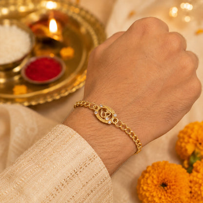 Hand wearing Om stone studded rakhi bracelet
