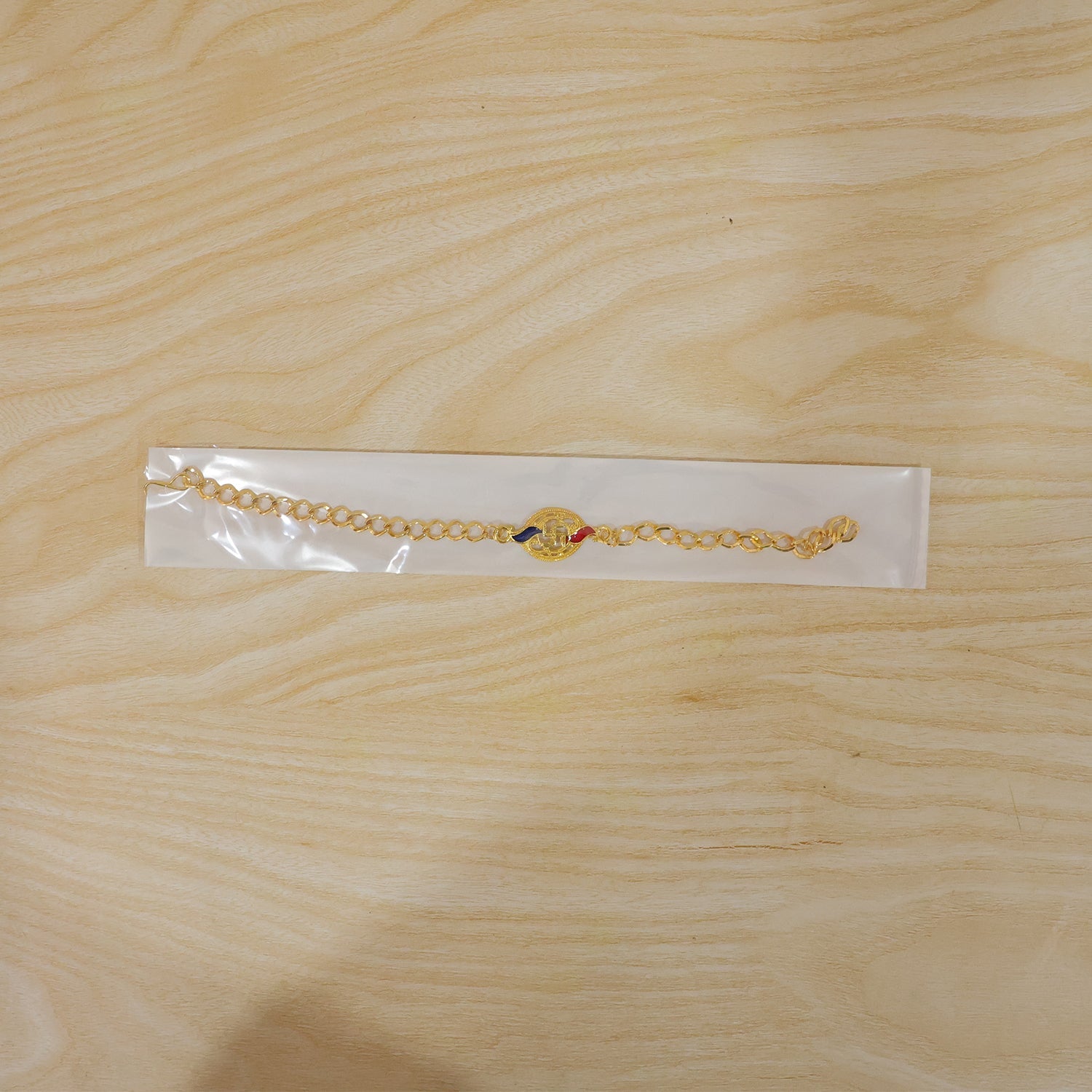 Swastik Enamel Gold Tone Bracelet Rakhi full bracelet view