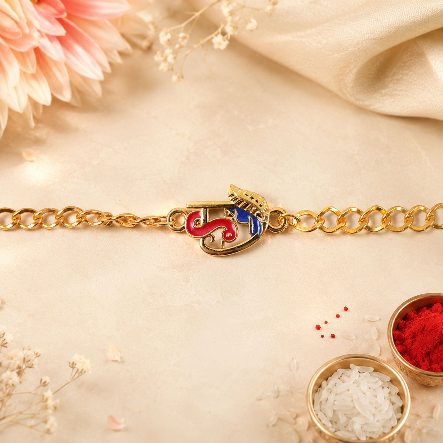 Side view of Festive Red Blue Enamel Rakhi bracelet