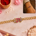Om Stone Studded Rakhi for Brother – Festive Gold Tone Design