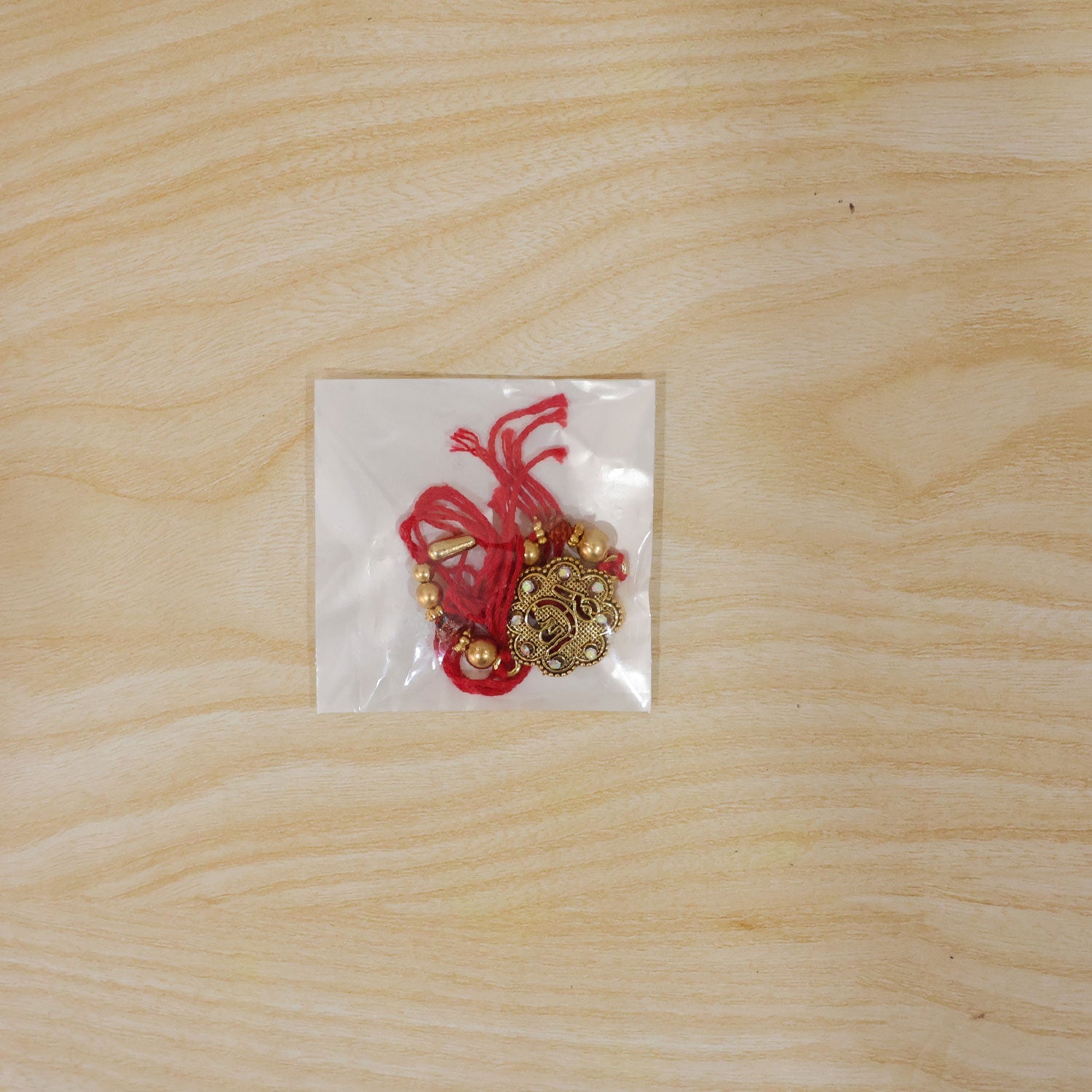 Stylish Stone Studded Gold Tone Rakhi