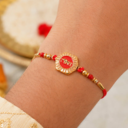 Veera Red Enamel Rakhi tied on a brother's wrist