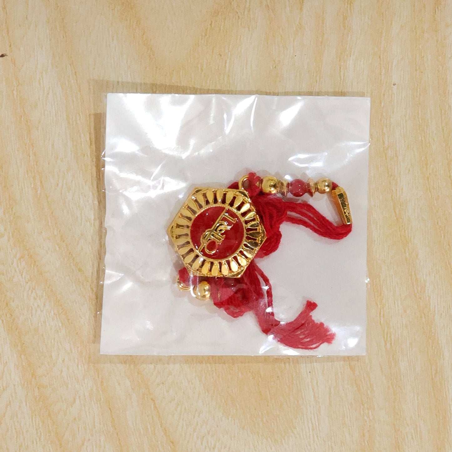 Back view of Veera Red Enamel Rakhi showing comfortable thread