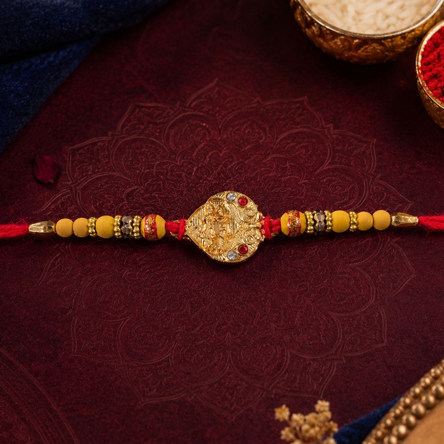 Top view of festive Golden Tone Rakhi