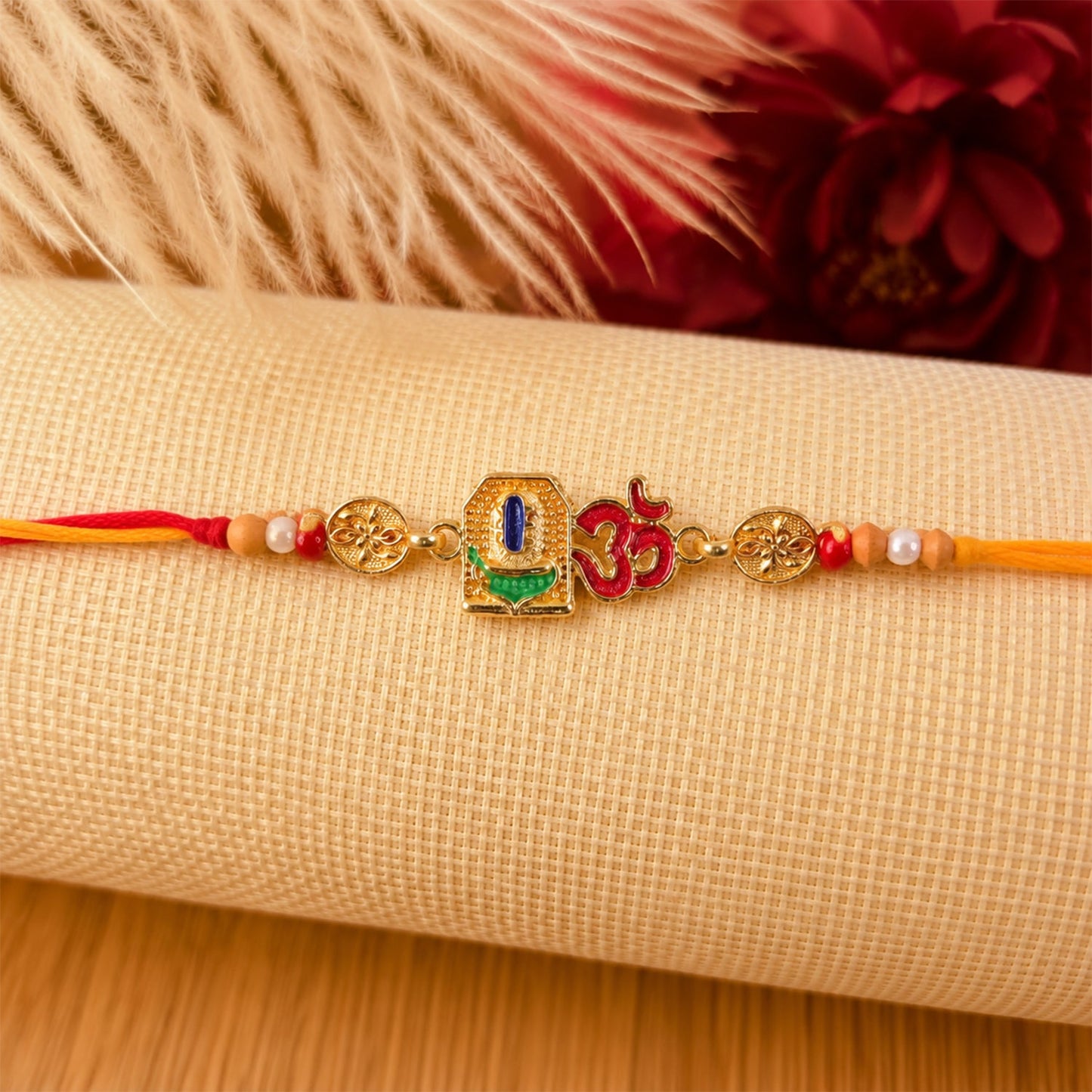 Om Blue Enamel Gold Tone Rakhi