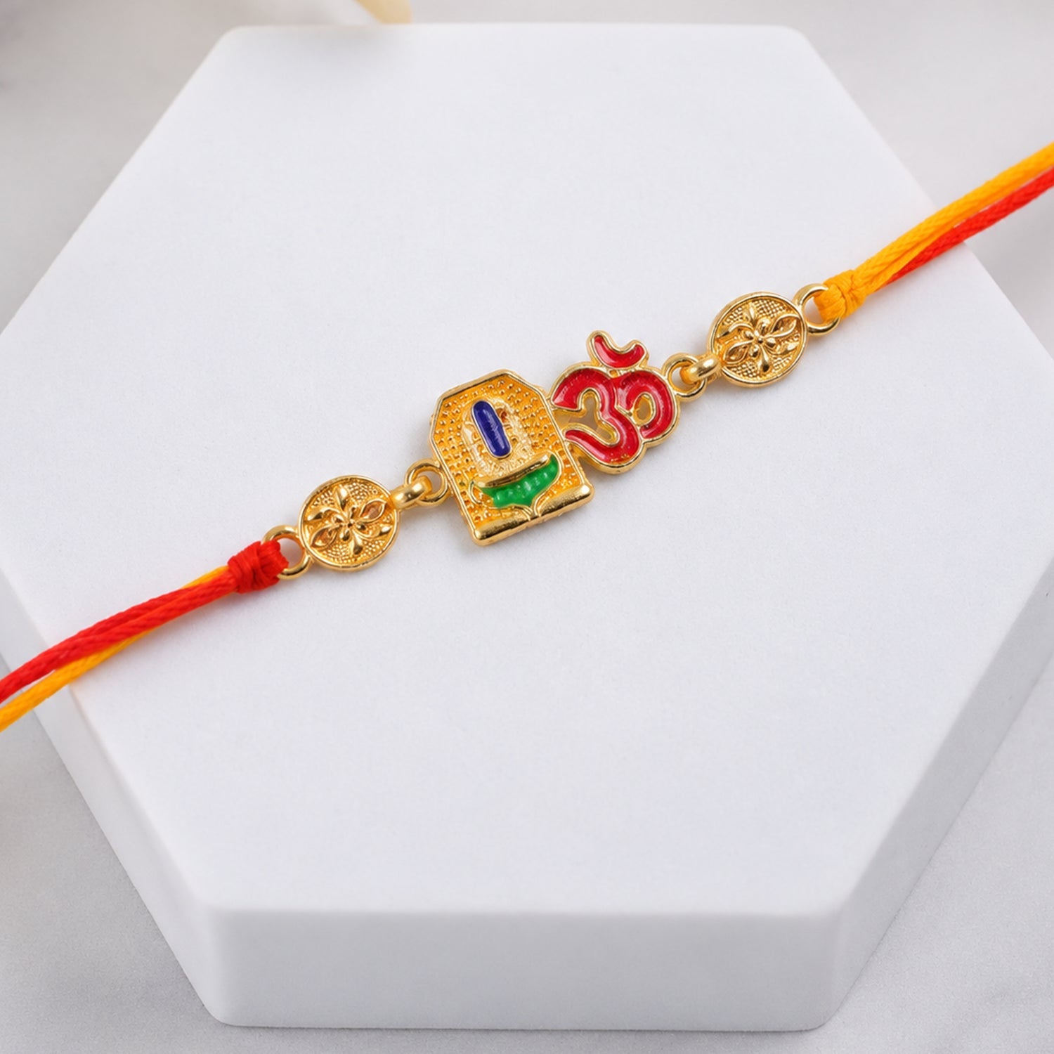 Om Blue Enamel Gold Tone Rakhi