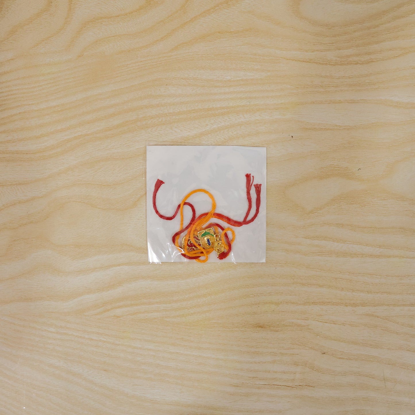 Om Blue Enamel Gold Tone Rakhi