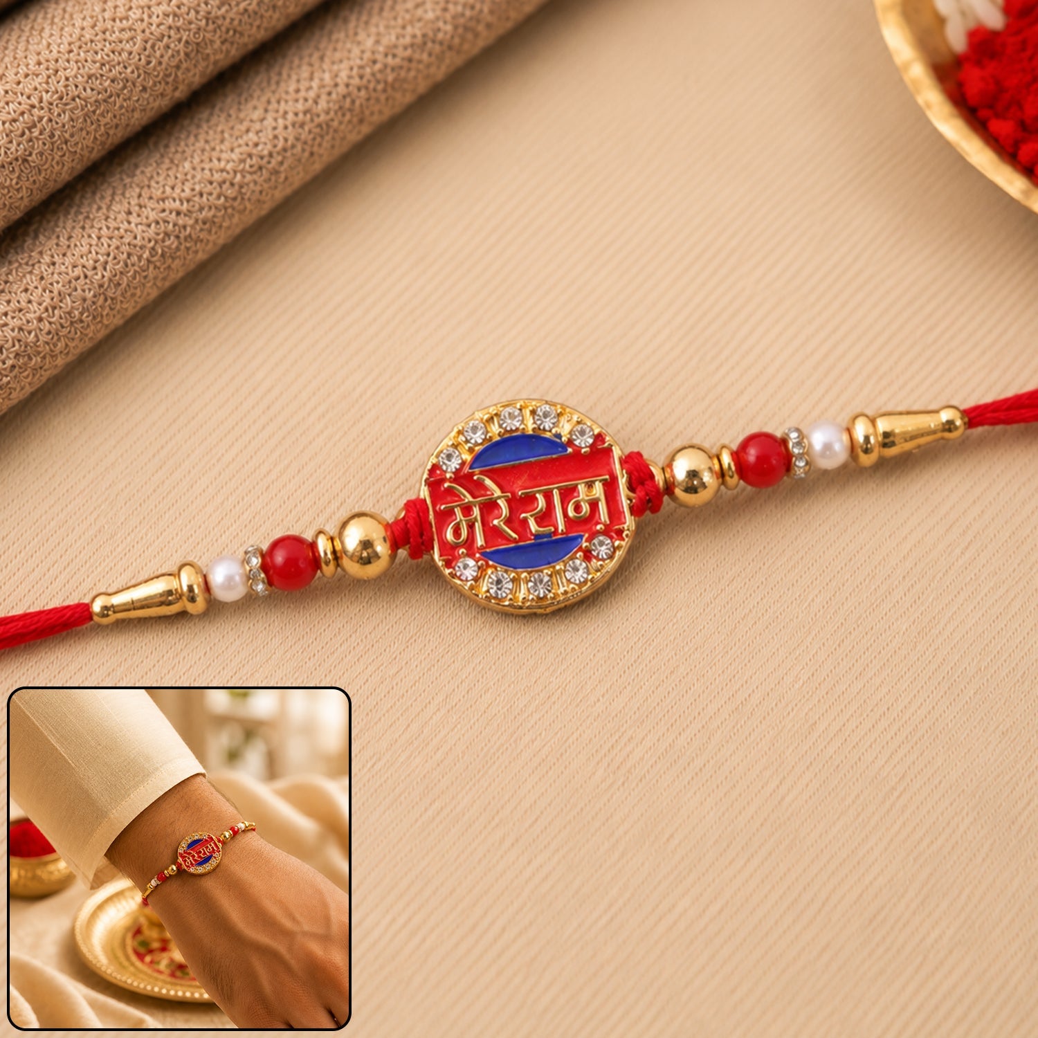 Close-up of Mere Ram Text Gold Tone Stone Studded Rakhi