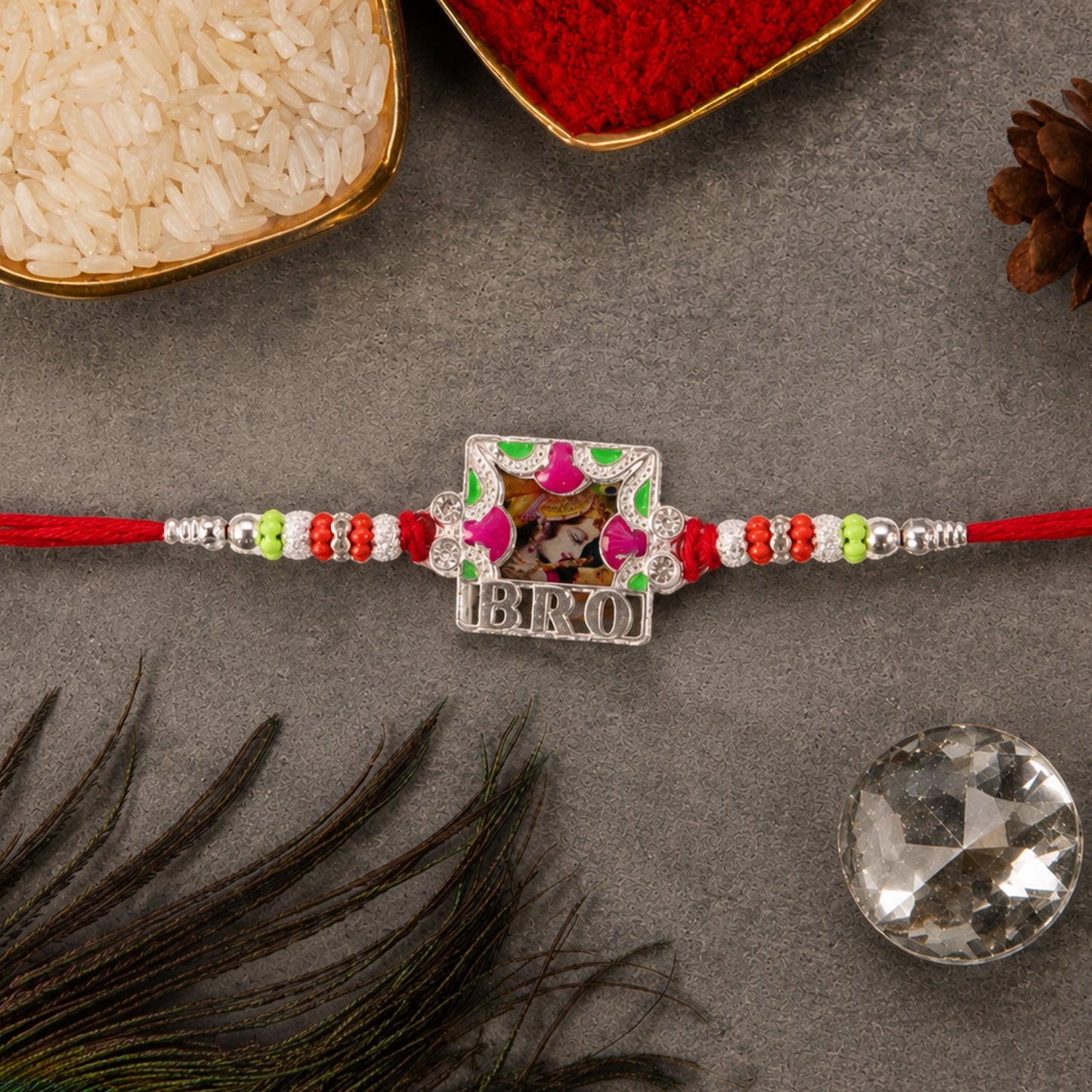 Close-up of the 'Bro' text frame Rakhi, highlighting colorful enamel