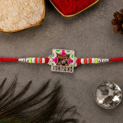 Close-up of the 'Bro' text frame Rakhi, highlighting colorful enamel