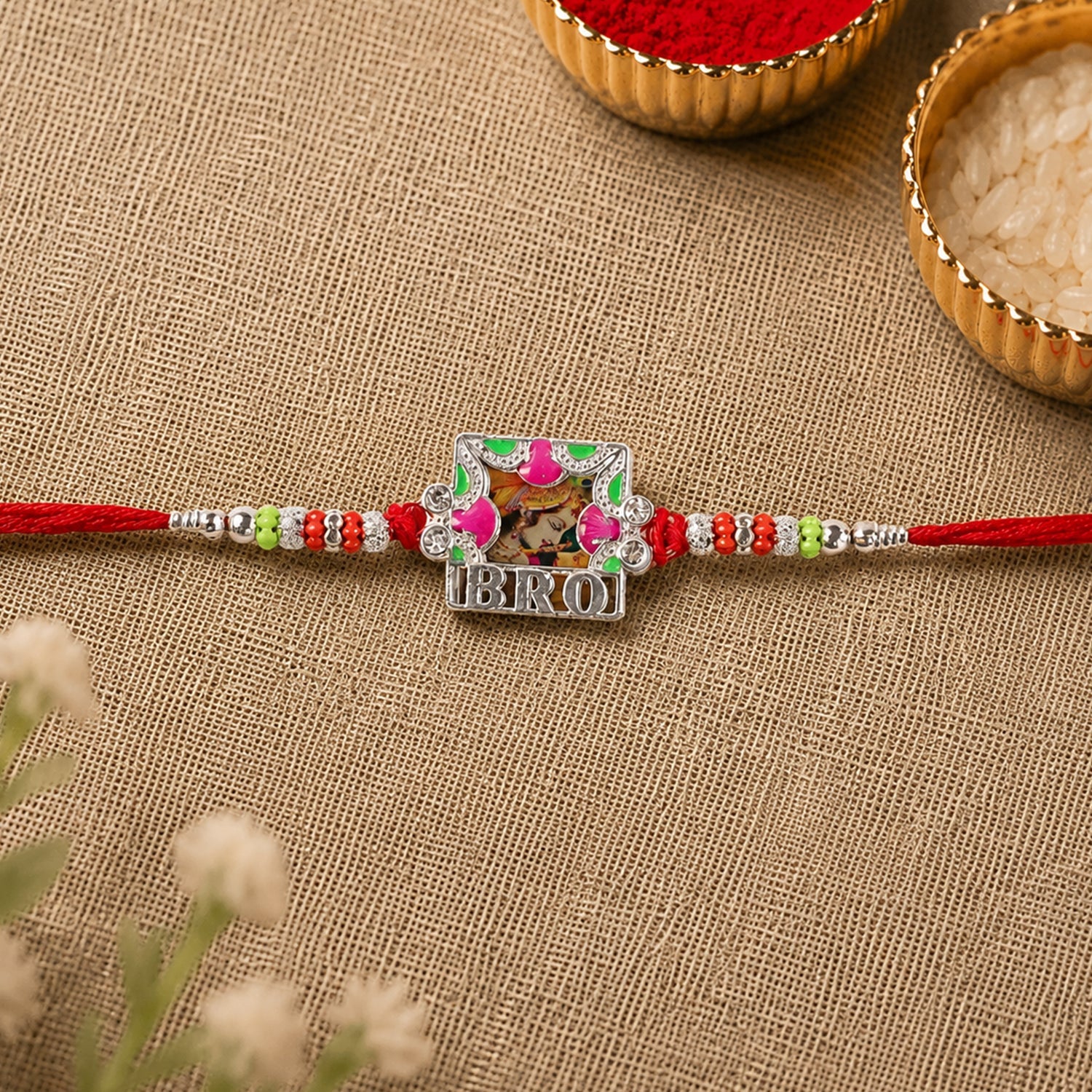 Top-down view of the 'Bro' text frame Rakhi with intricate detailing