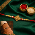 Lord Ganesha Antique Rakhi – Festive Gold Tone for Brother
