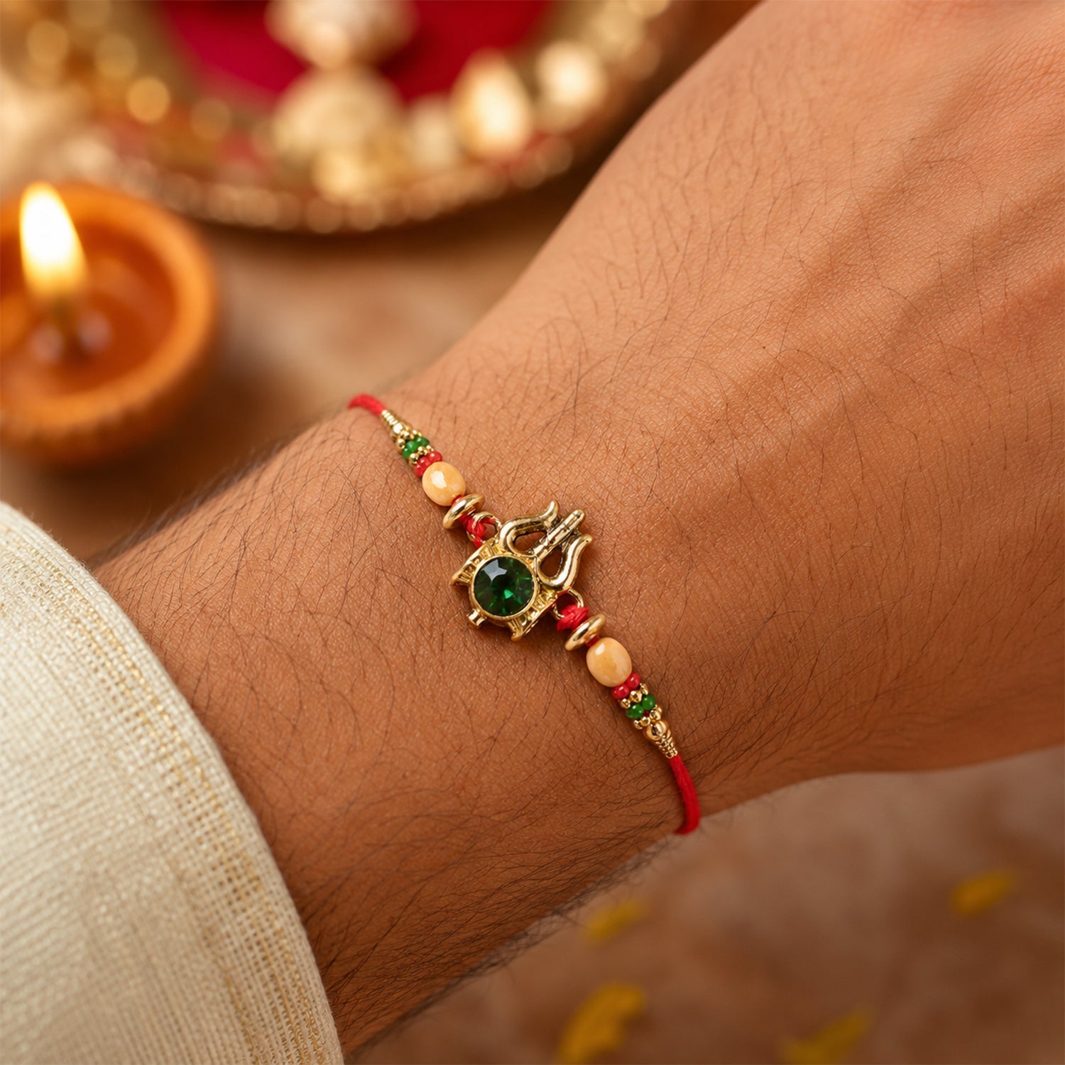 Trishul Damru Stone Studded Gold Tone Rakhi