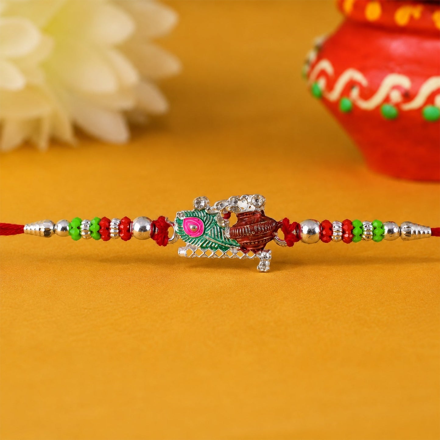 Krishna Matki Rakhi showcasing intricate beadwork