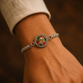 Silver Oxidized Meenakari Om Rakhi – Elegant Sunray Design for Brother
