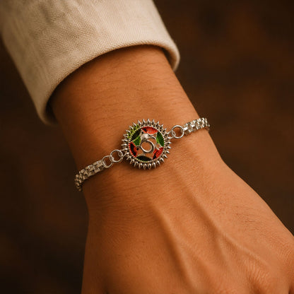 Silver Oxidized Meenakari Om Rakhi with Sunray Design