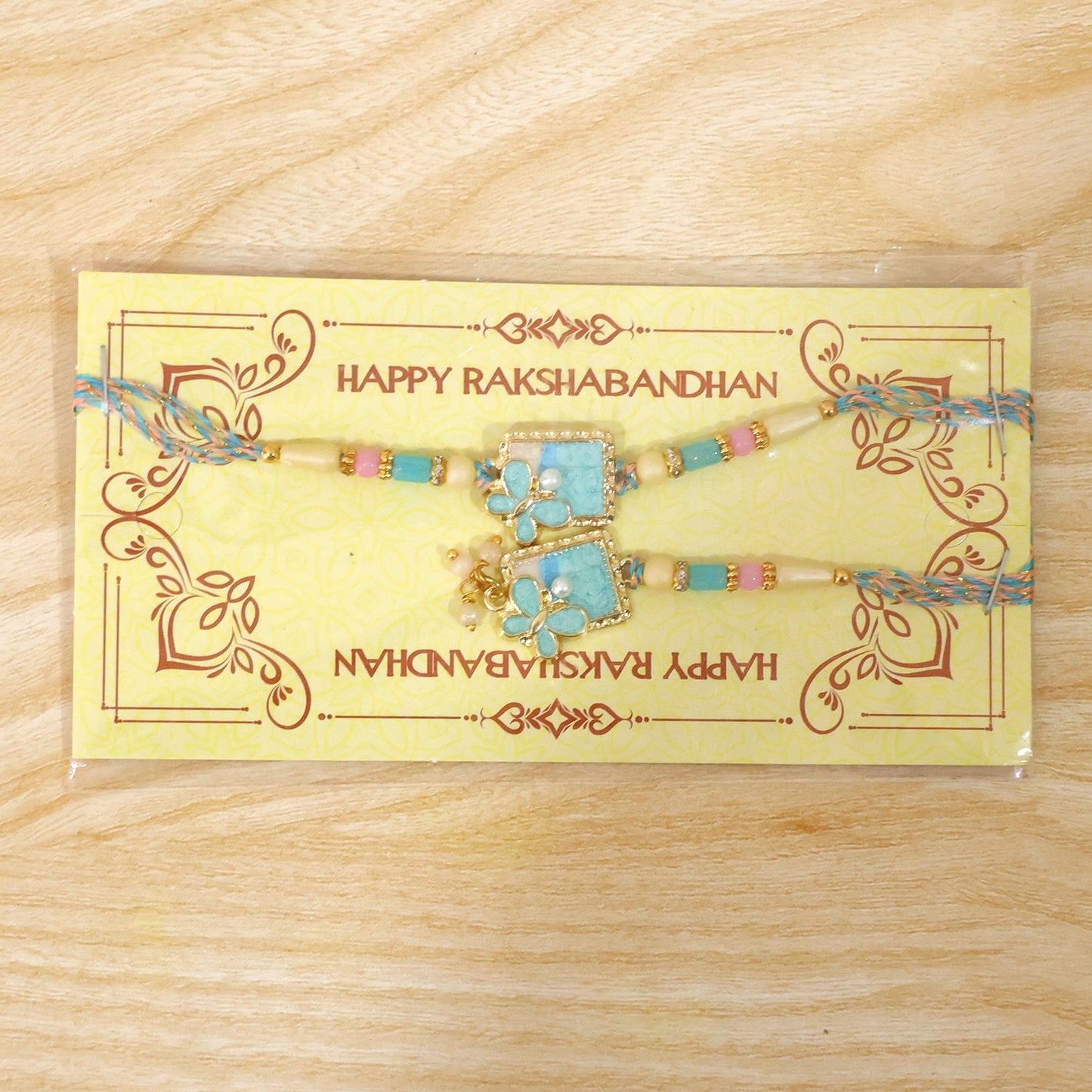 Turquoise Floral Bhaiya Bhabhi Lumba Rakhi with Pearls
