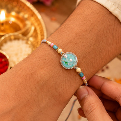 Teal Floral Bhaiya Bhabhi Lumba Rakhi with Pearl Drops