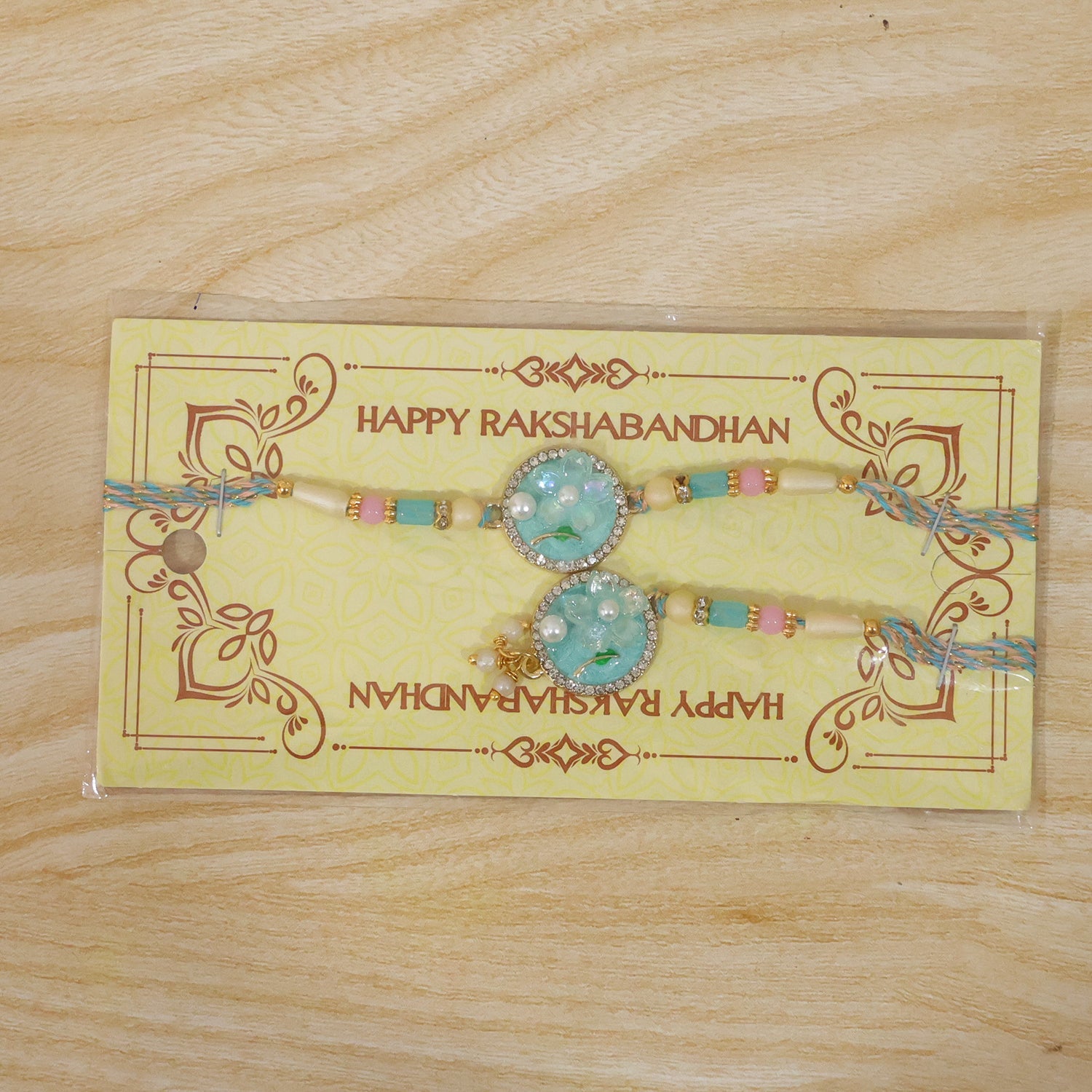 Teal Floral Bhaiya Bhabhi Lumba Rakhi with Pearl Drops