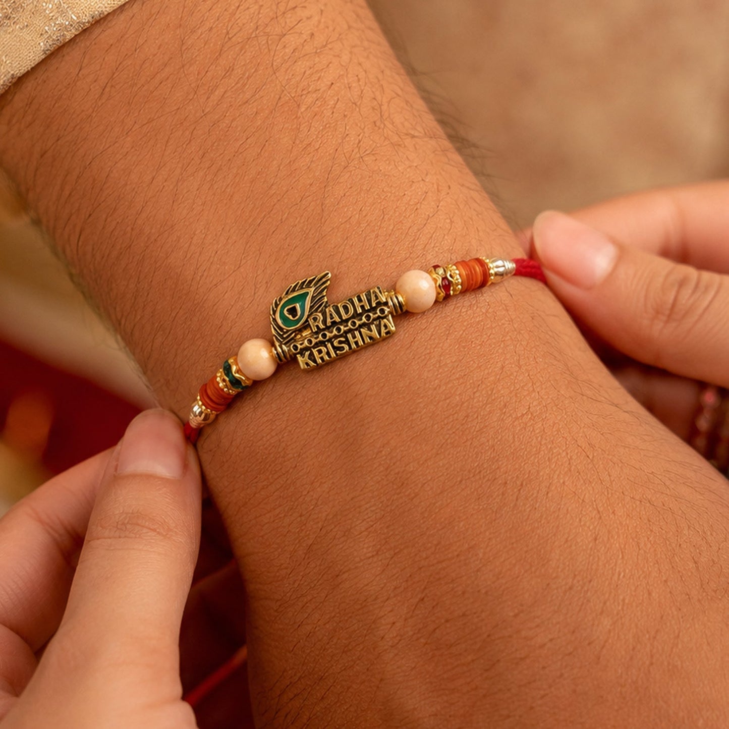 Radha Krishna Peacock Feather Stone Studded Gold Tone Rakhi for Brother