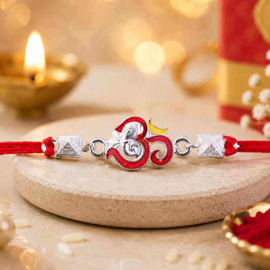 Elegant silver Om Ganesha enamel pyramid bead rakhi for Raksha Bandhan