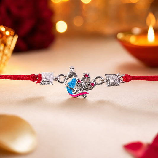 Silver peacock enamel bead Rakhi with traditional design for Raksha Bandhan