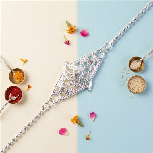 Diamond-shaped leaf stone studded Rakhi with elegant design