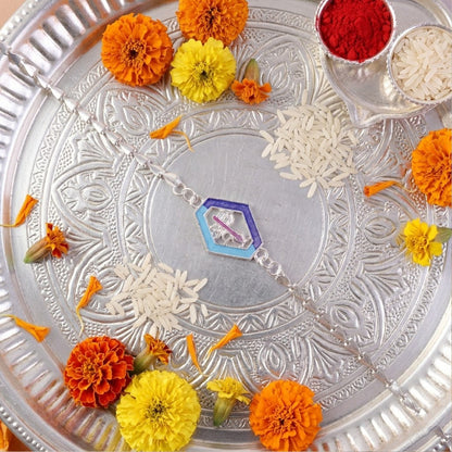 Festive Rakhi with Shiva charm and leaf chain design