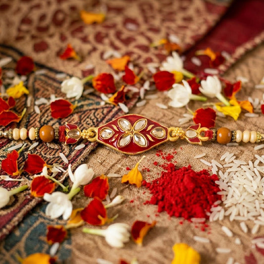 Close-up of the elegant Marquise Kundan floral enamel Rakhi for brother.