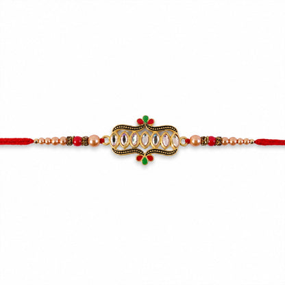 Front view of the traditional kundan stone Rakhi with golden beads.