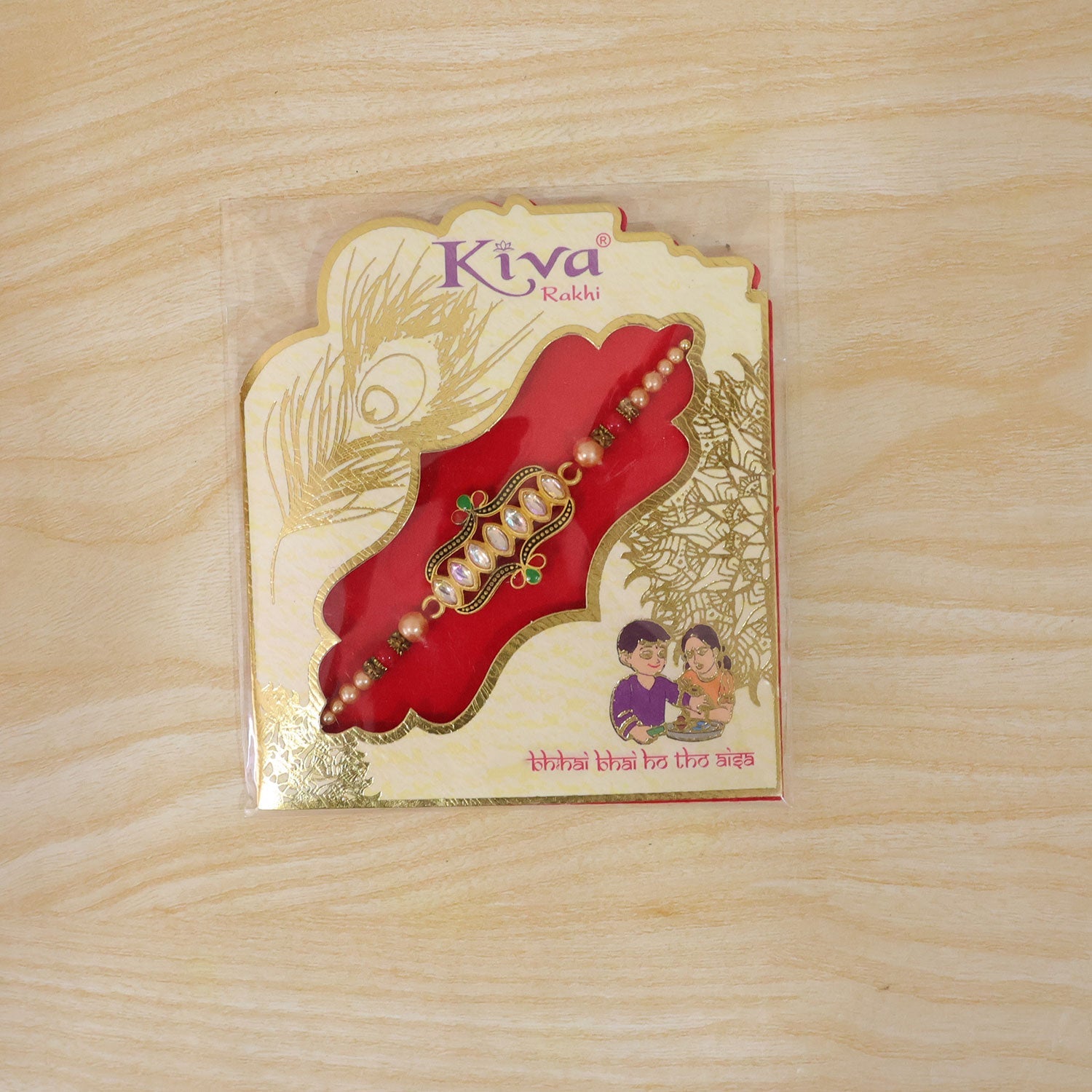 Side angle of the designer Rakhi, highlighting its studded kundan stones.