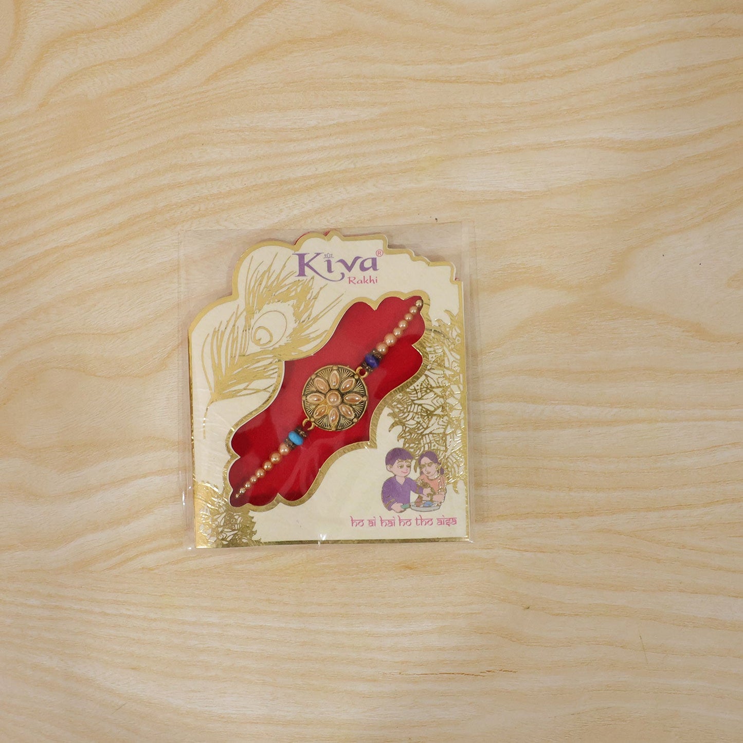 Back view of the kundan stone rakhi showing thread details and finish.