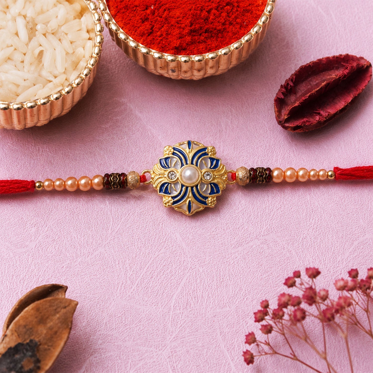 Side view of the designer floral meenakari rakhi for Raksha Bandhan.
