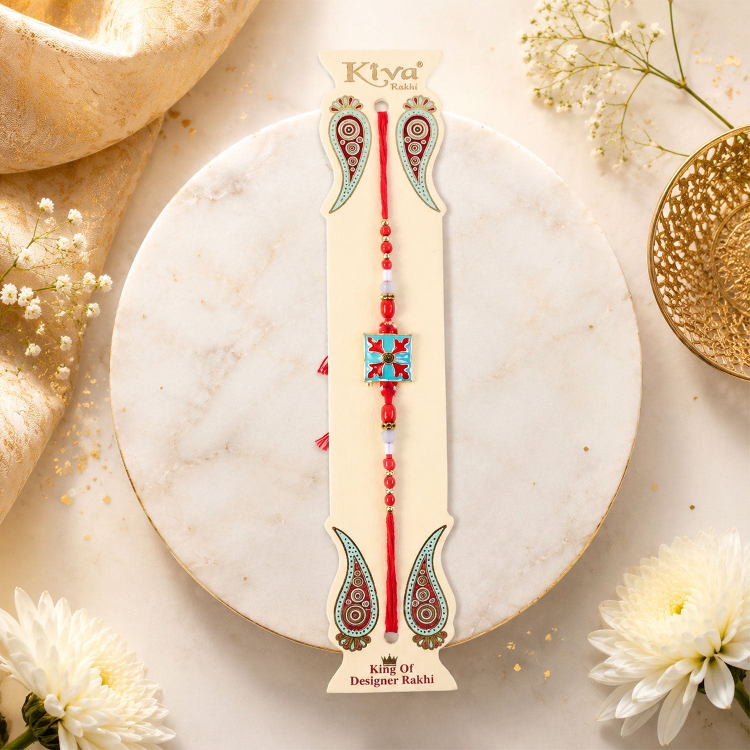 Close-up of the square design charm and colourful beads on the Kids Rakhi.