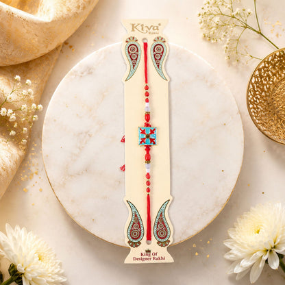 Close-up of the square design charm and colourful beads on the Kids Rakhi.