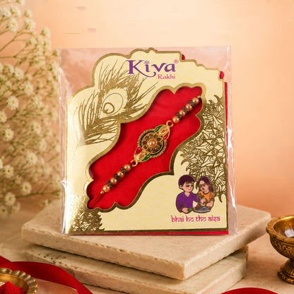 Detailed view of the floral design and kundan stones on the Rakhi for brother.