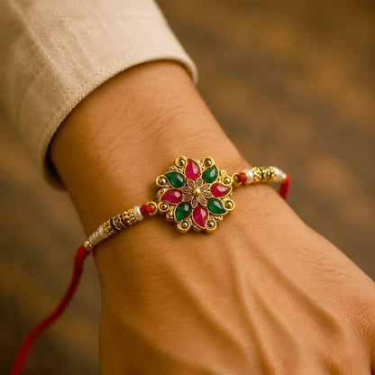 Side view of the handcrafted Floral Stone Designer Rakhi thread and central motif.