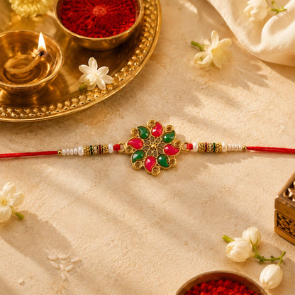Close up of the floral stone and Kundan bead work on the designer Rakhi.
