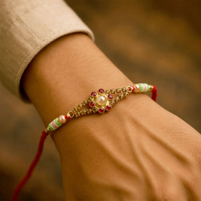 Close up of the pearl stone and decorative bead work on the rakhi.