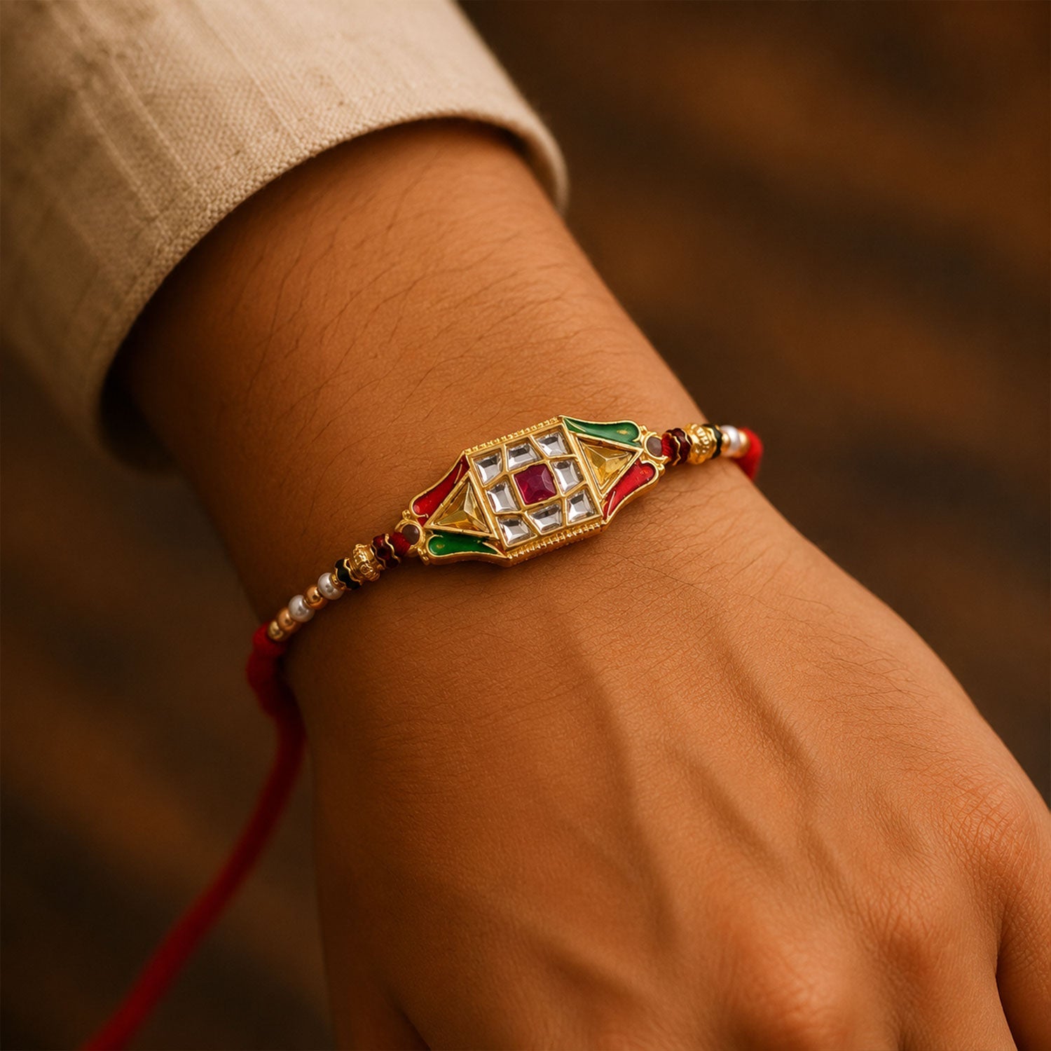 Side view of the Rakhi for brother, highlighting the pearl bead detailing.