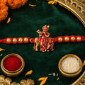 Round Evil Eye Mandala Stone Rakhi with Pearl Beads and Festive Center Charm