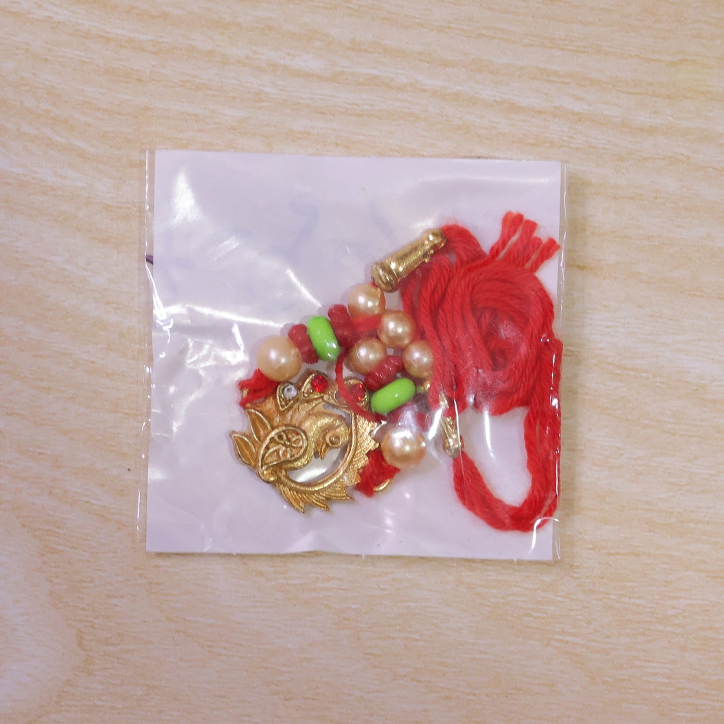 Elegant Peacock Design Rakhi with Pearl Beadwork Rakhi for Brother