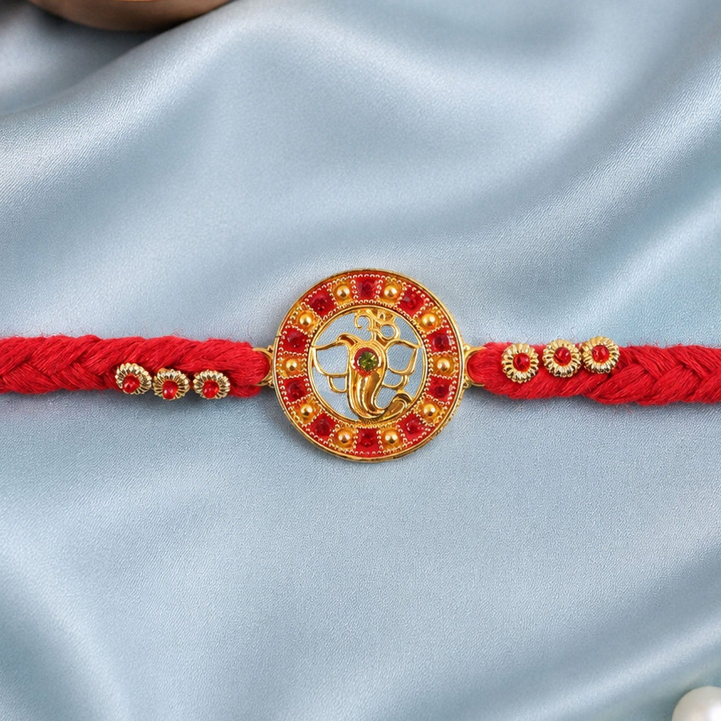 Divine Ganesha Round Rakhi with Stone Studded Border Rakhi for Brother