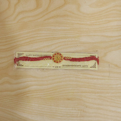 Divine Ganesha Round Rakhi with Stone Studded Border Rakhi for Brother