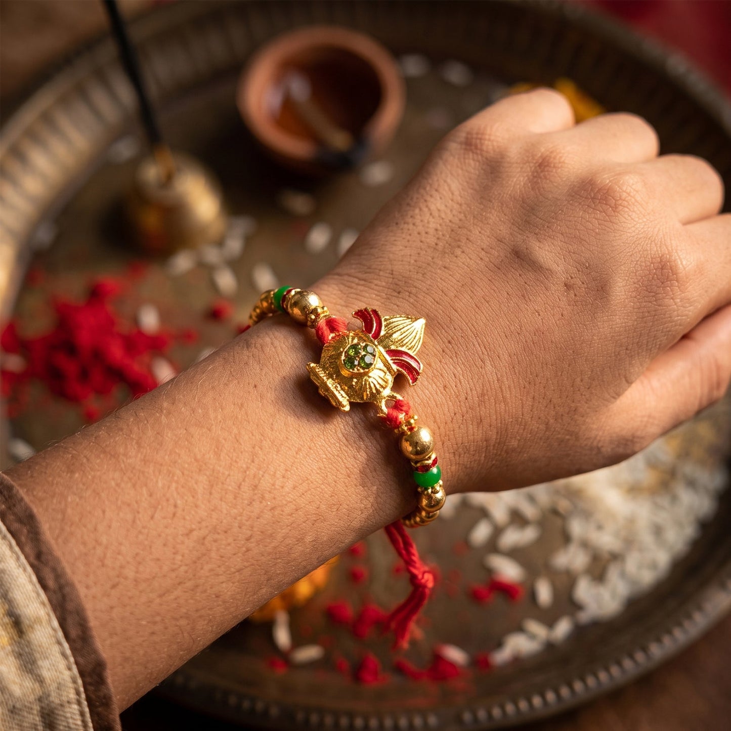 Traditional Golden Kalash Motif Rakhi with Beadwork Rakhi for Brother