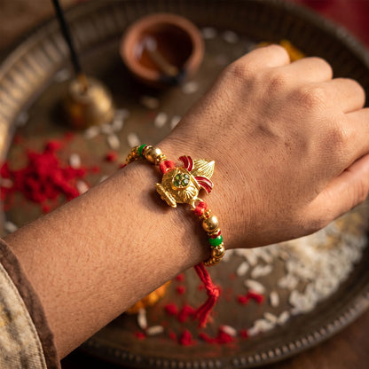 Traditional Golden Kalash Motif Rakhi with Beadwork Rakhi for Brother