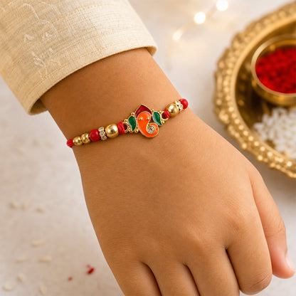 Detailed view of the beads and thread on the Ganesha Rakhi.