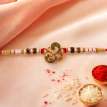 Traditional Om Antique Rakhi with Pearl Beads – Rakhi for Brother