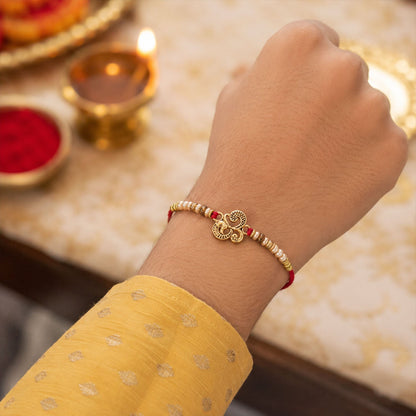 Traditional Om Antique Rakhi with Pearl Beads – Rakhi for Brother