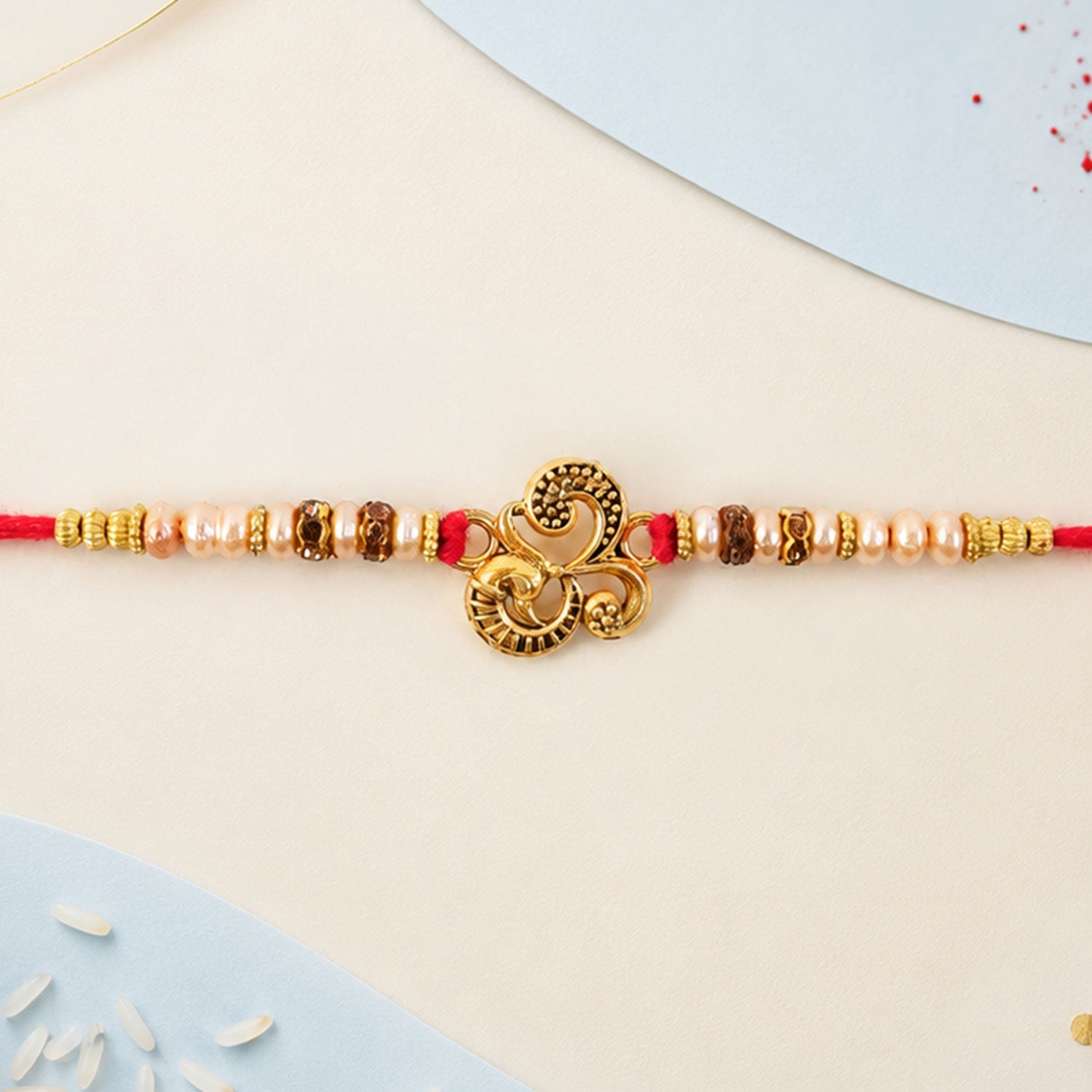 Traditional Om Antique Rakhi with Pearl Beads – Rakhi for Brother